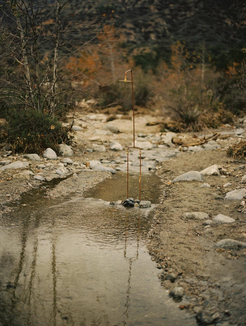 Poolside copper shower system with polished brass fittings