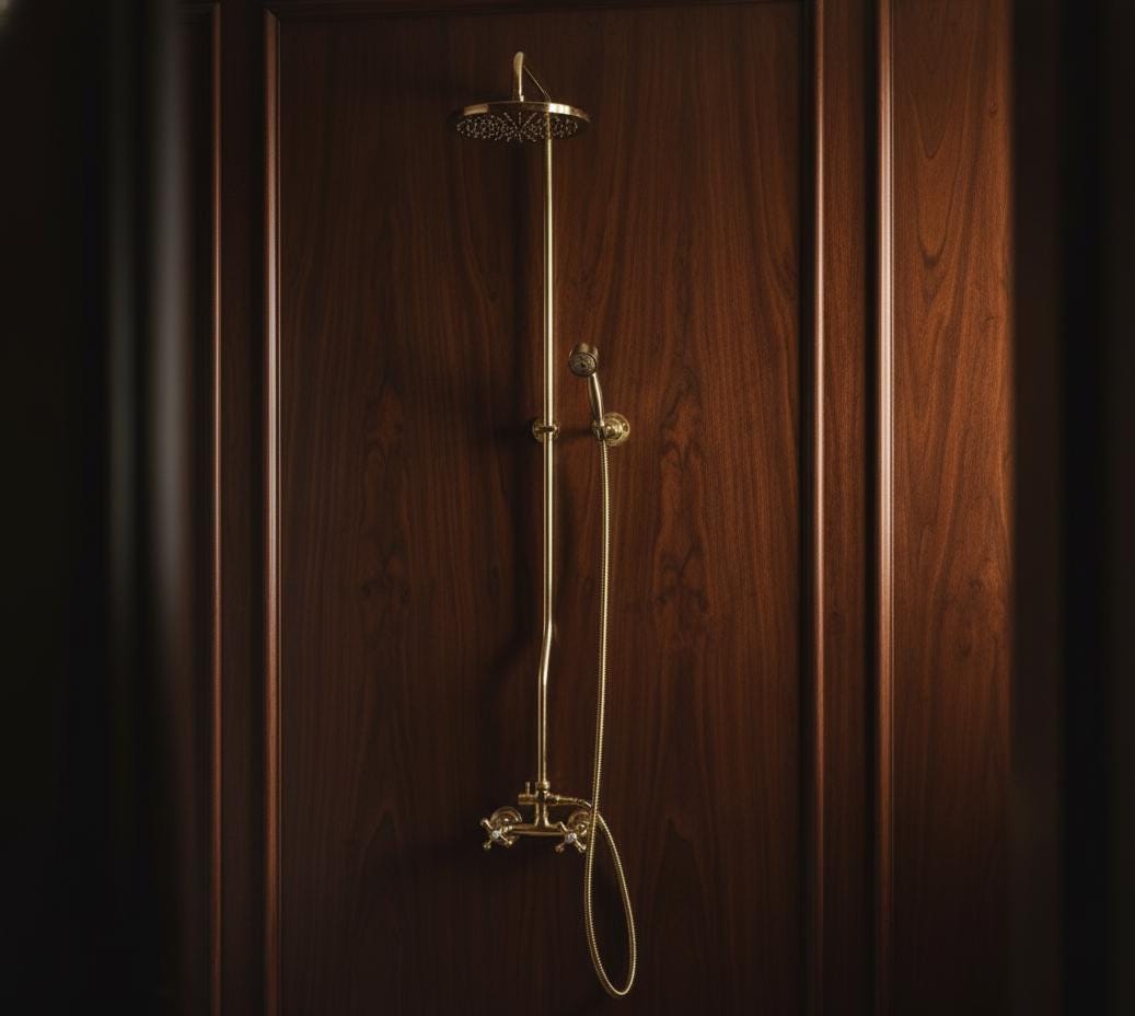 Gold shower head and hose on a wooden panel