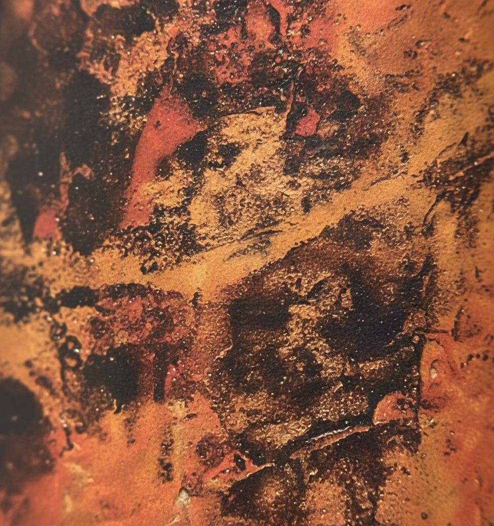 Close-up of a textured surface with brown and black colors