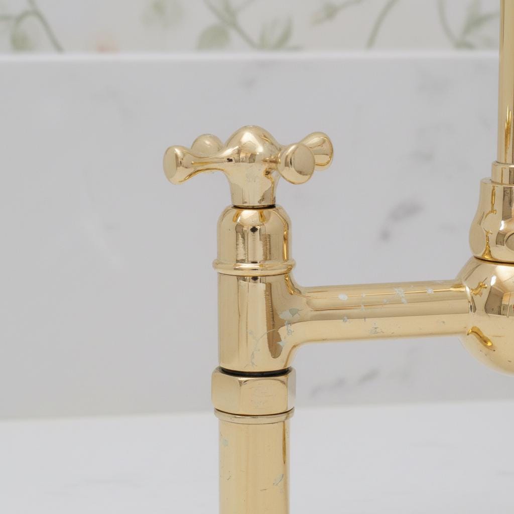 Gold faucet on a marble background