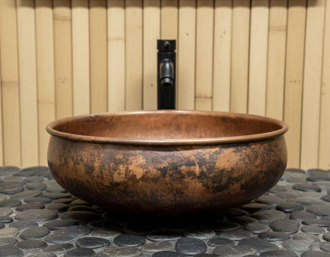 Copper sink on a stone surface with wooden panel background
