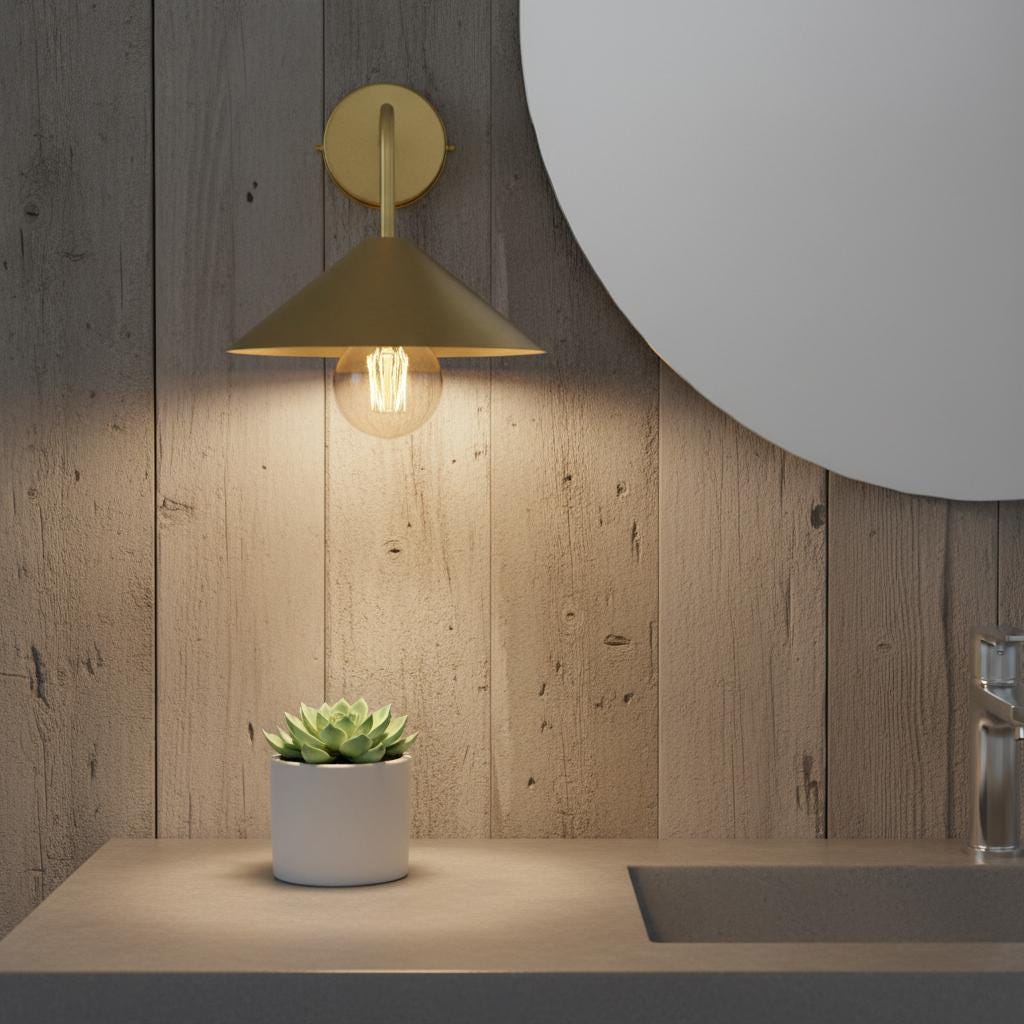Gold wall sconce lighting a potted plant on a wooden surface with a wooden wall background