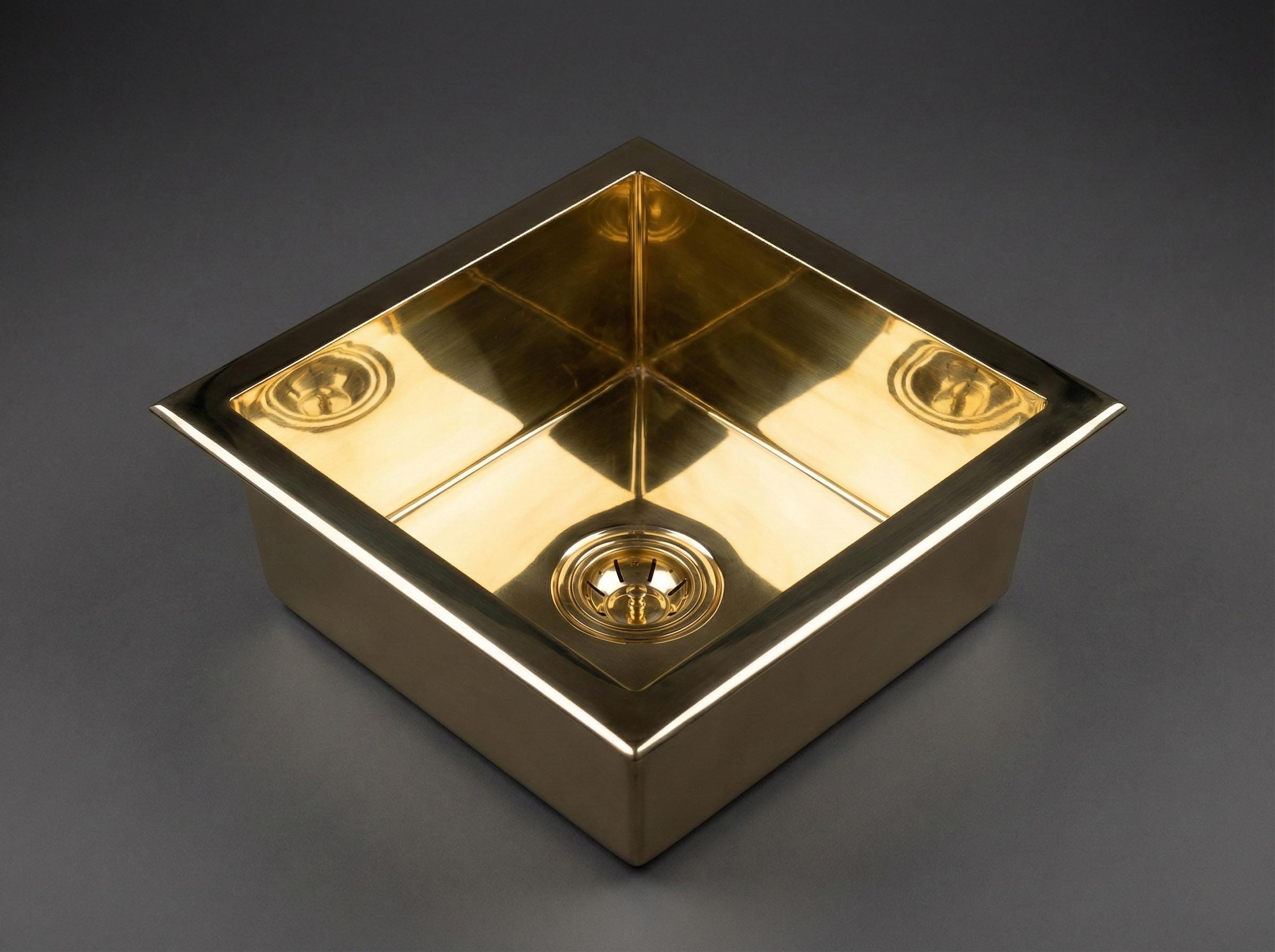 Gold square object with reflective surface on a dark gray background
