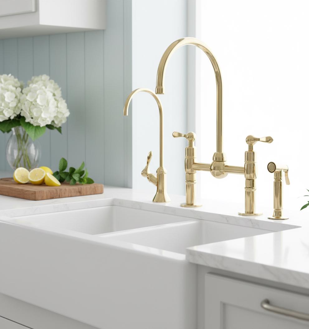 Gold kitchen faucet set on a marble countertop with a neutral background