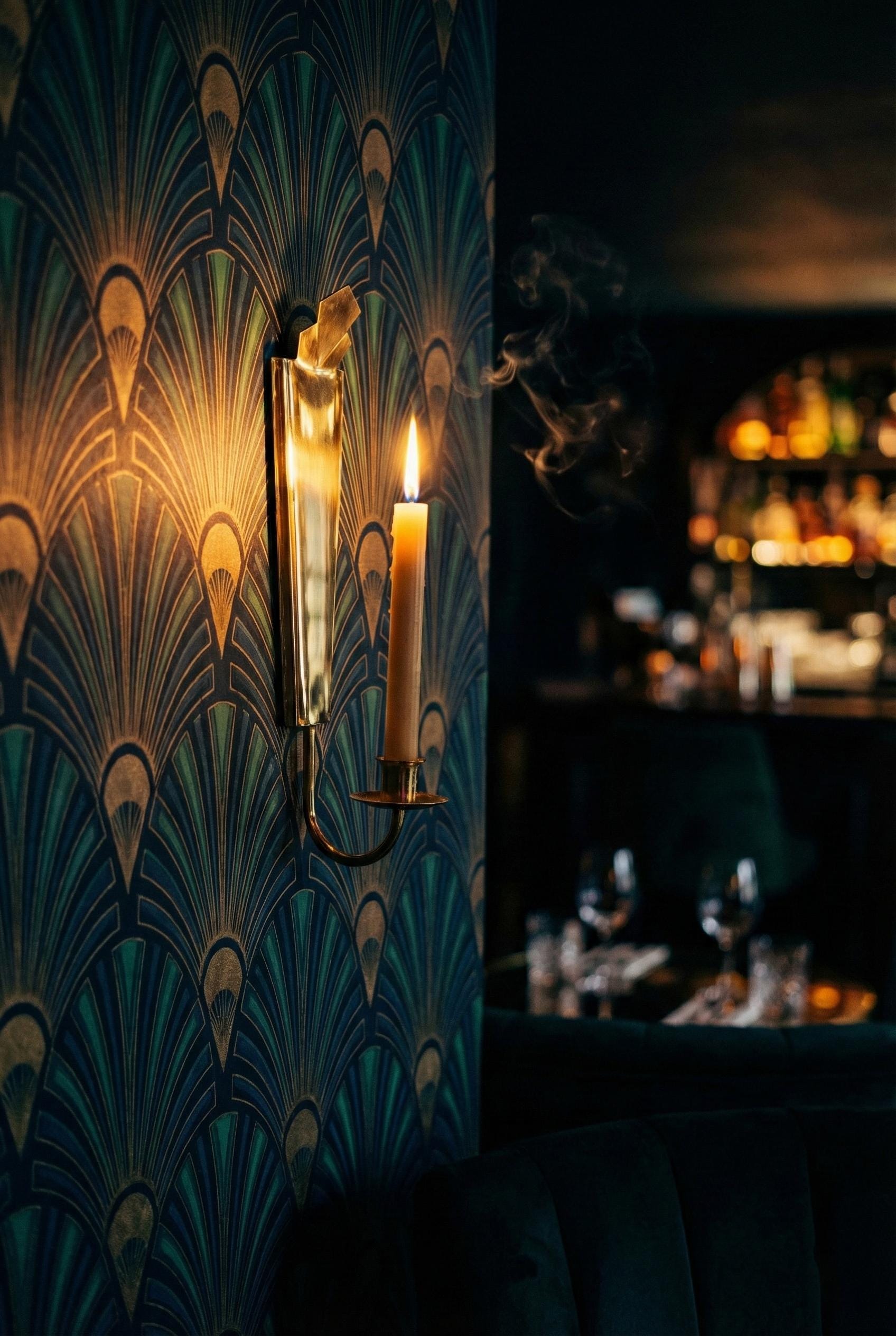 Decorative wall sconce with a candle in a bar setting