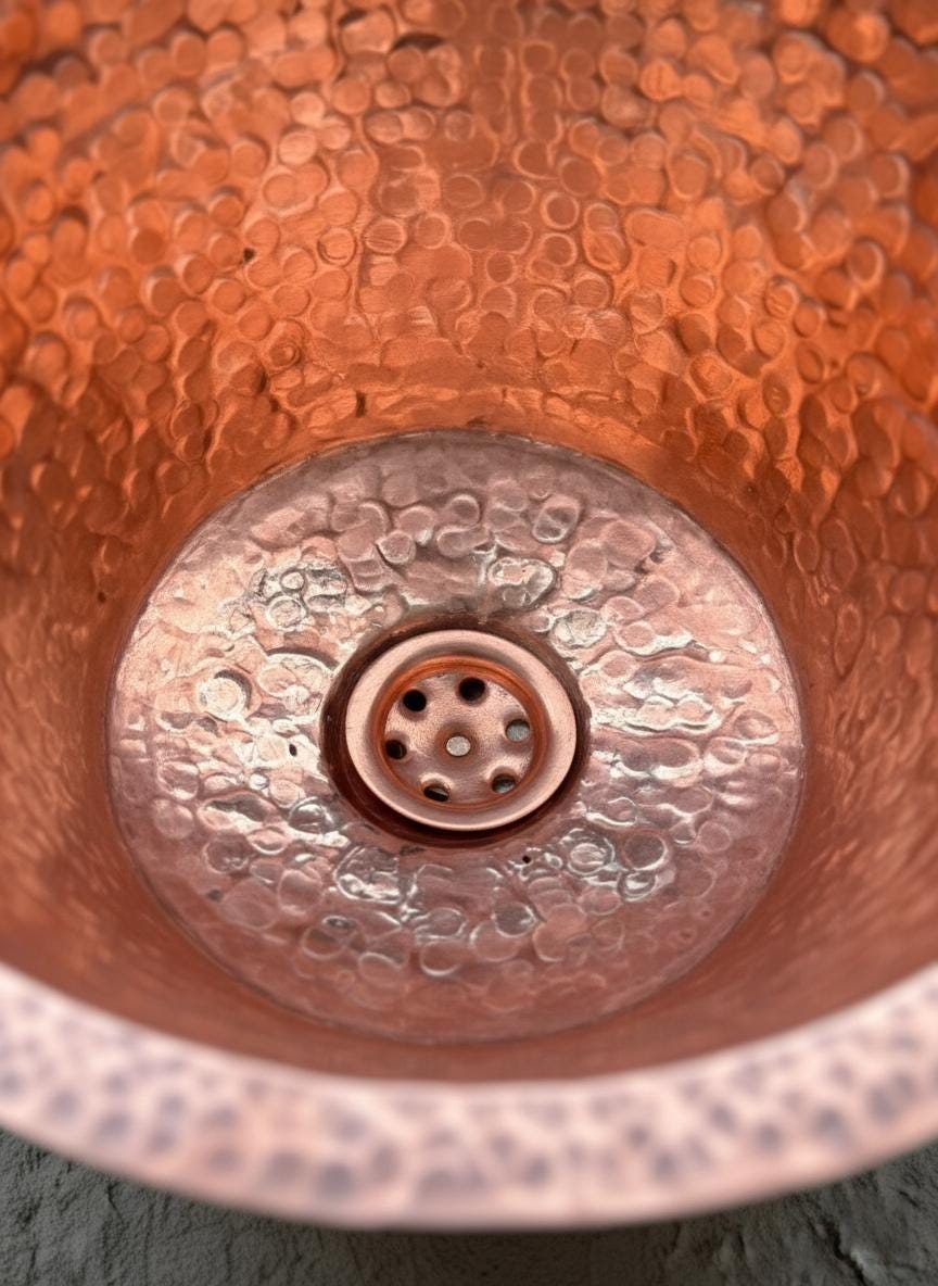 Close-up of a copper sink with textured surface