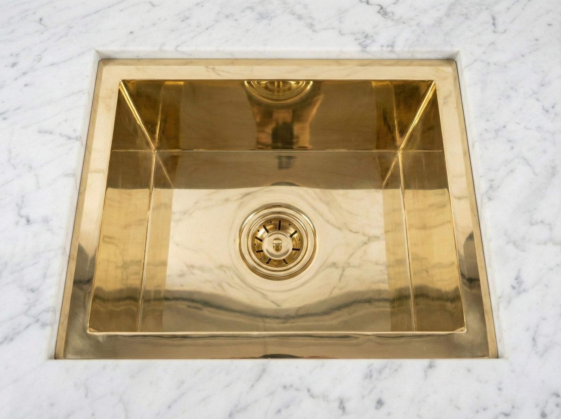 Gold sink on a marble countertop