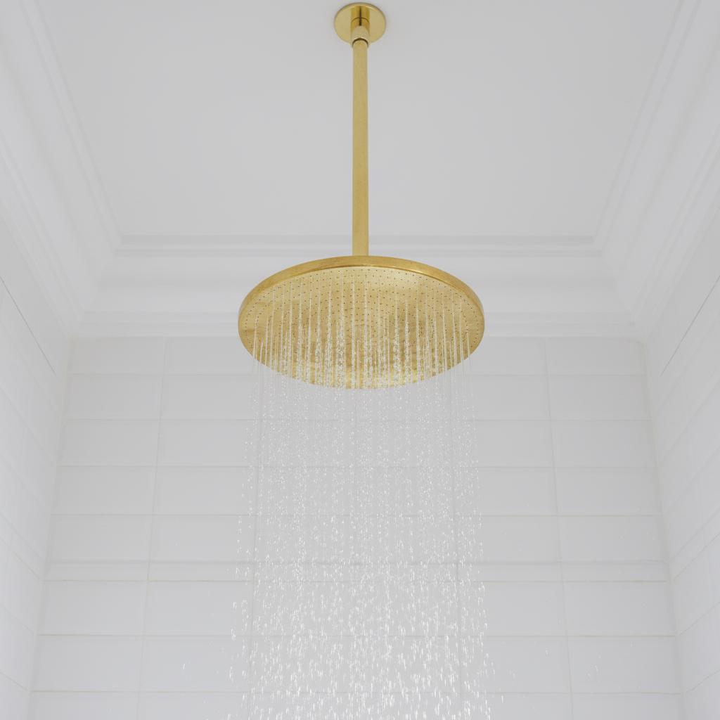 Gold pendant light fixture on a white ceiling