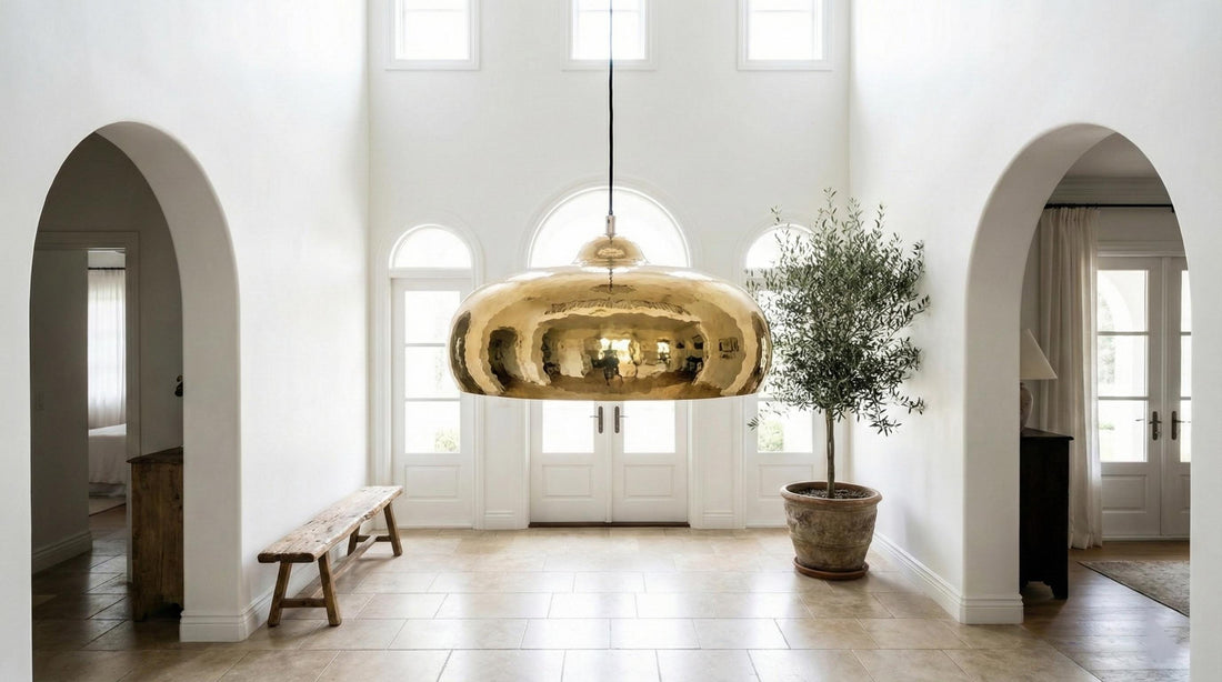 Modern kitchen with gold pendant lights and marble countertop