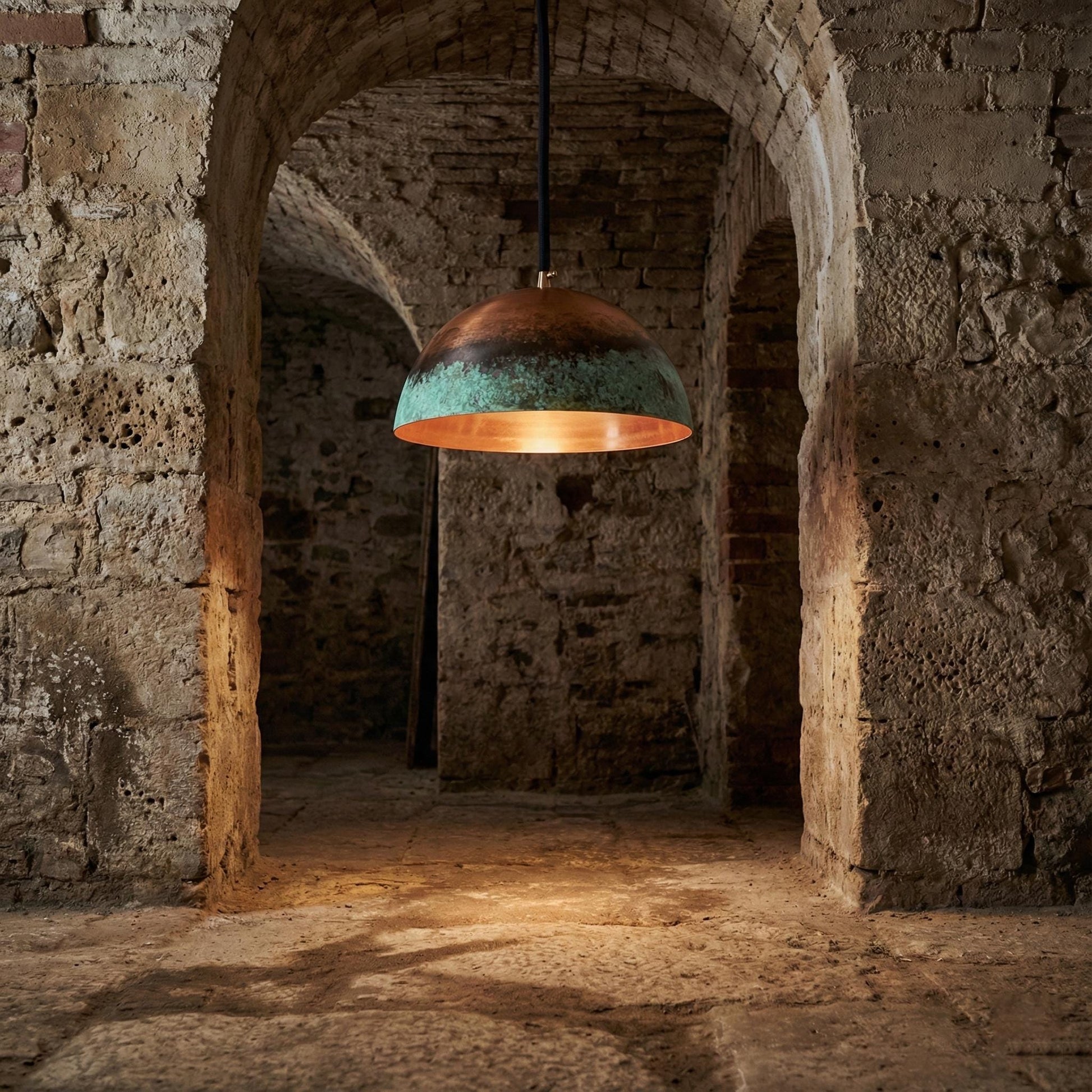 Vintage-style pendant light hanging in a stone archway