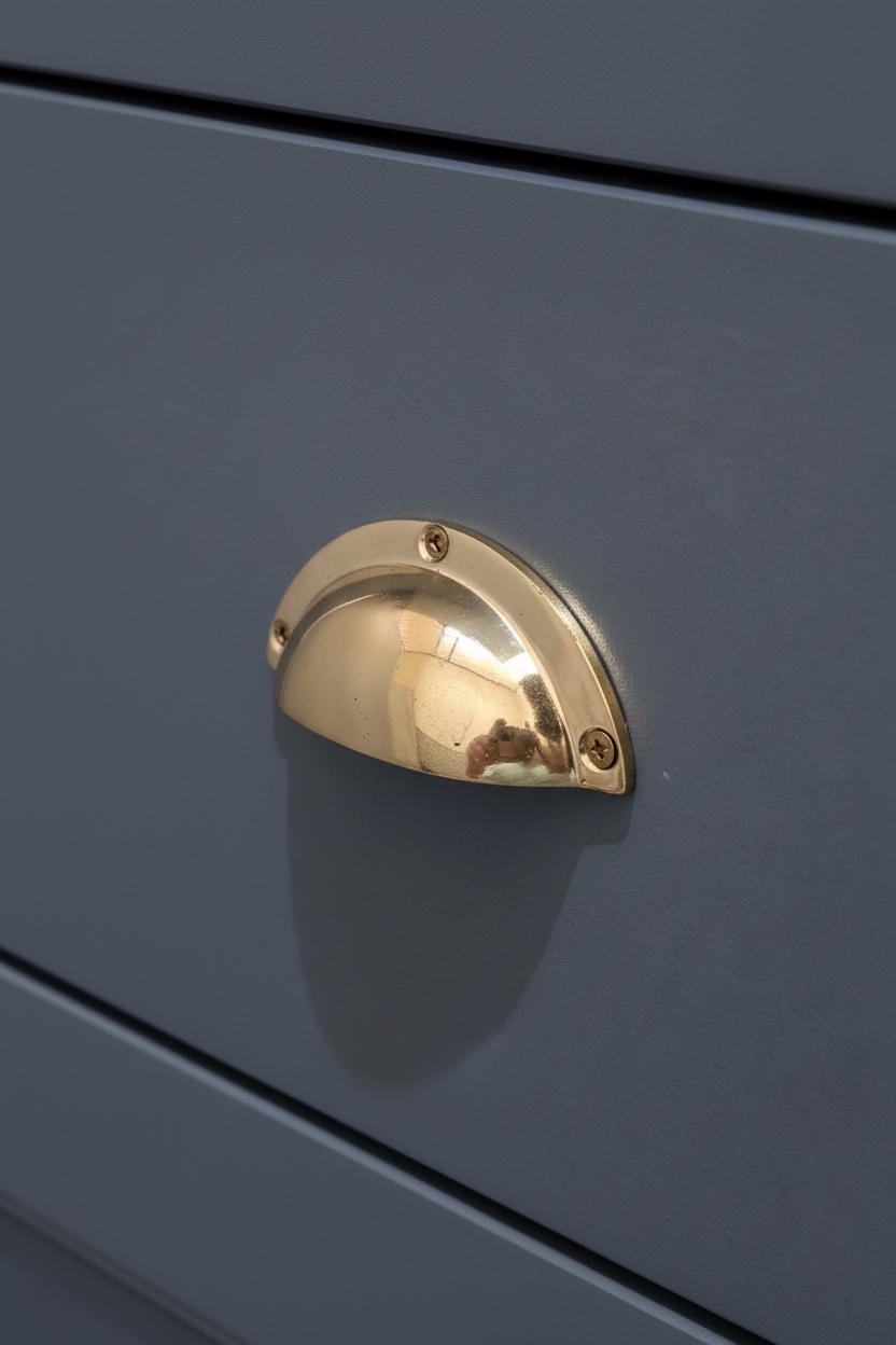Gold handle on a blue drawer