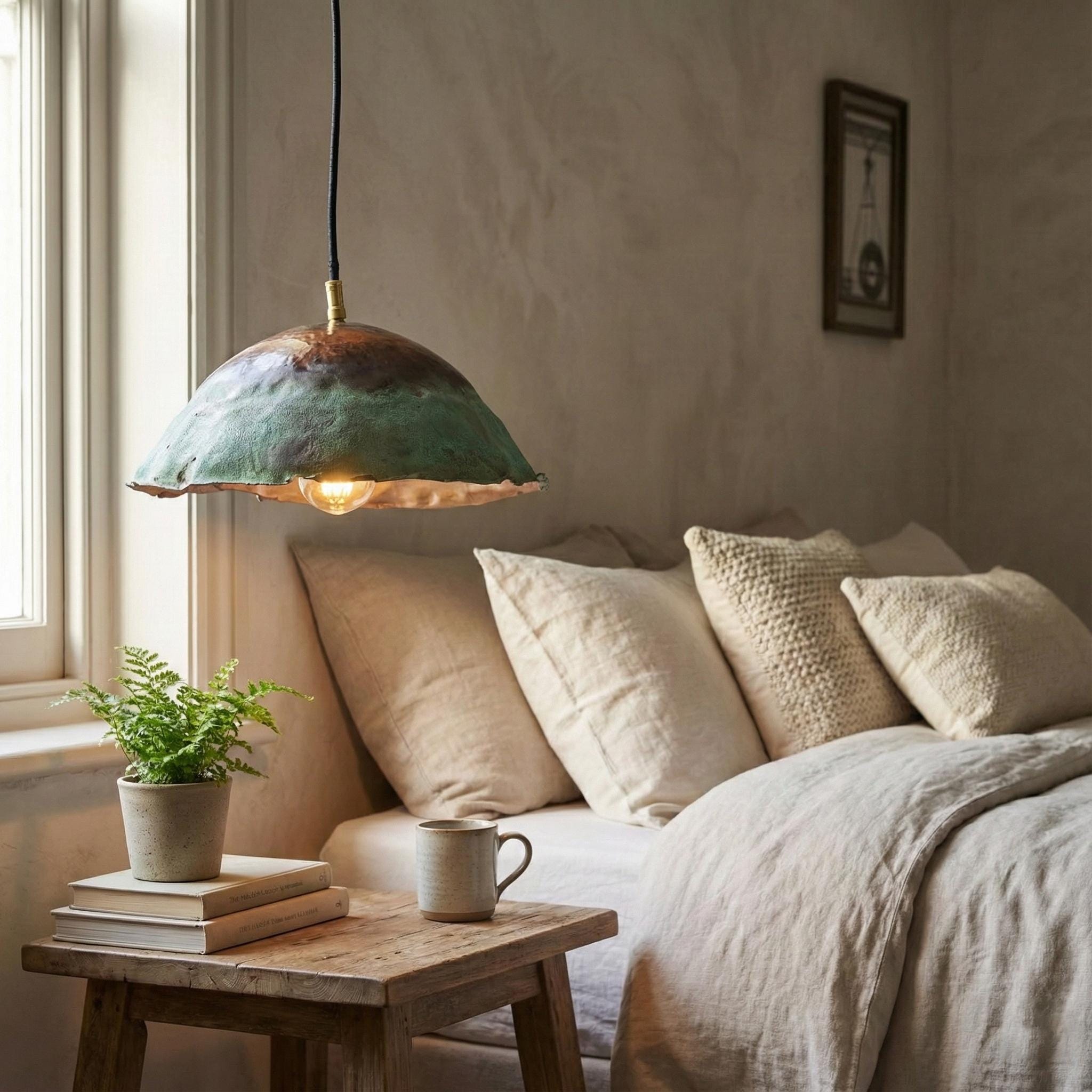 Cozy living room with a pendant light, sofa, and small table.