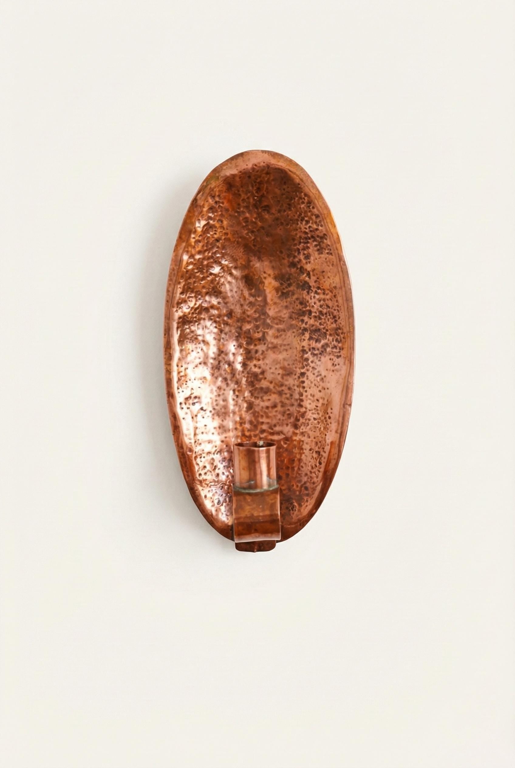Copper wall sconce on a white background
