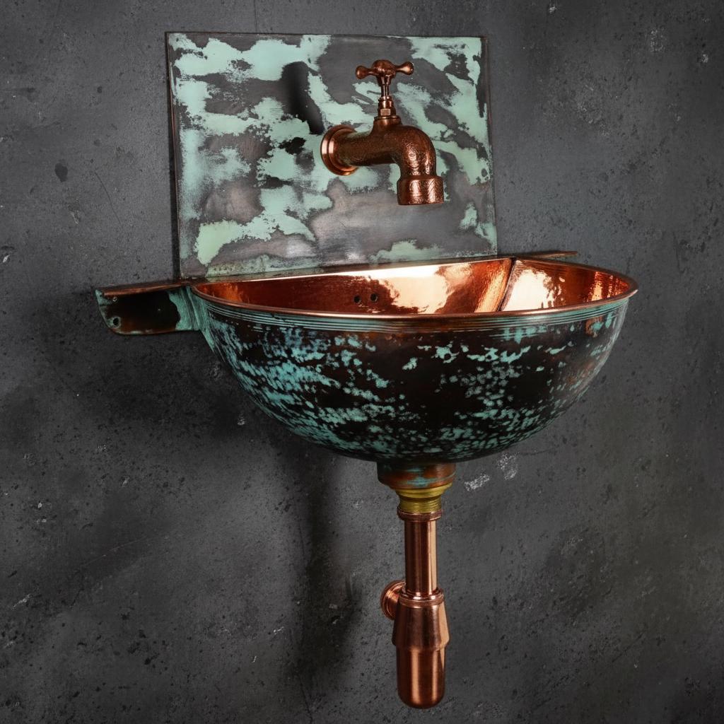 Vintage-style copper sink with faucet on a dark gray background