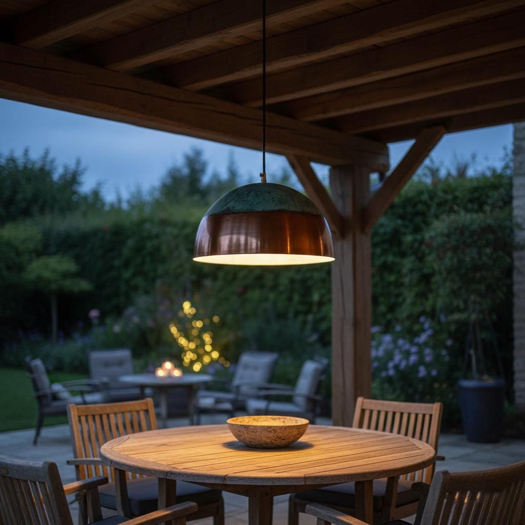 Outdoor patio setting with wooden table and chairs under a hanging lamp.
