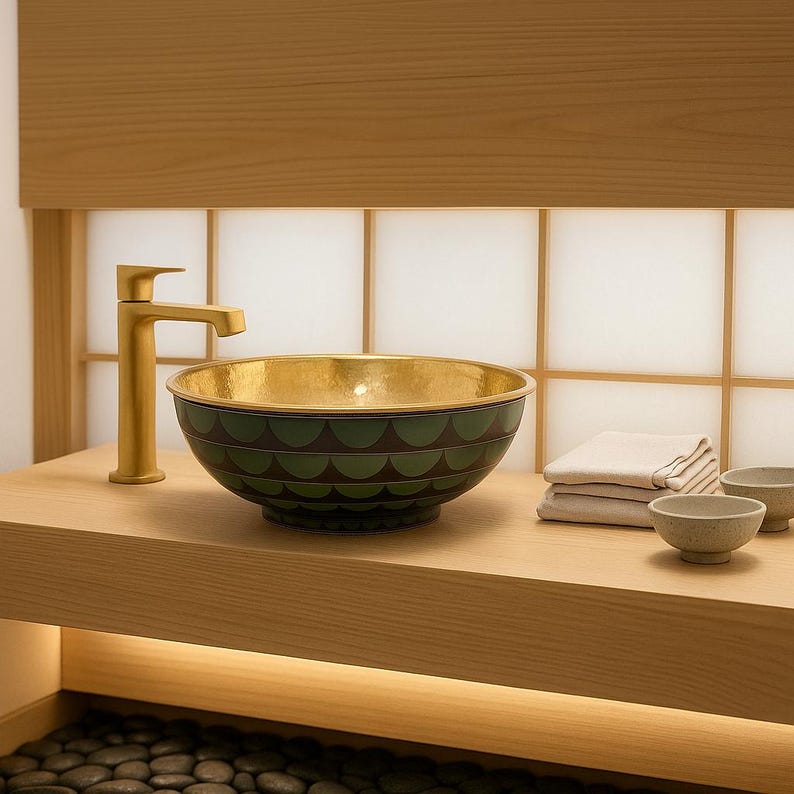 Artisan bathroom sink with green enamel inlay pattern