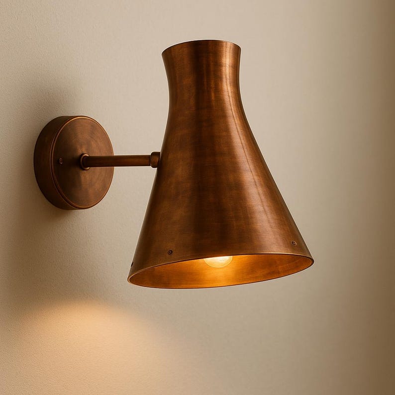 Artisan hammered copper wall lamp for patio or entryway – warm metallic cone sconce

