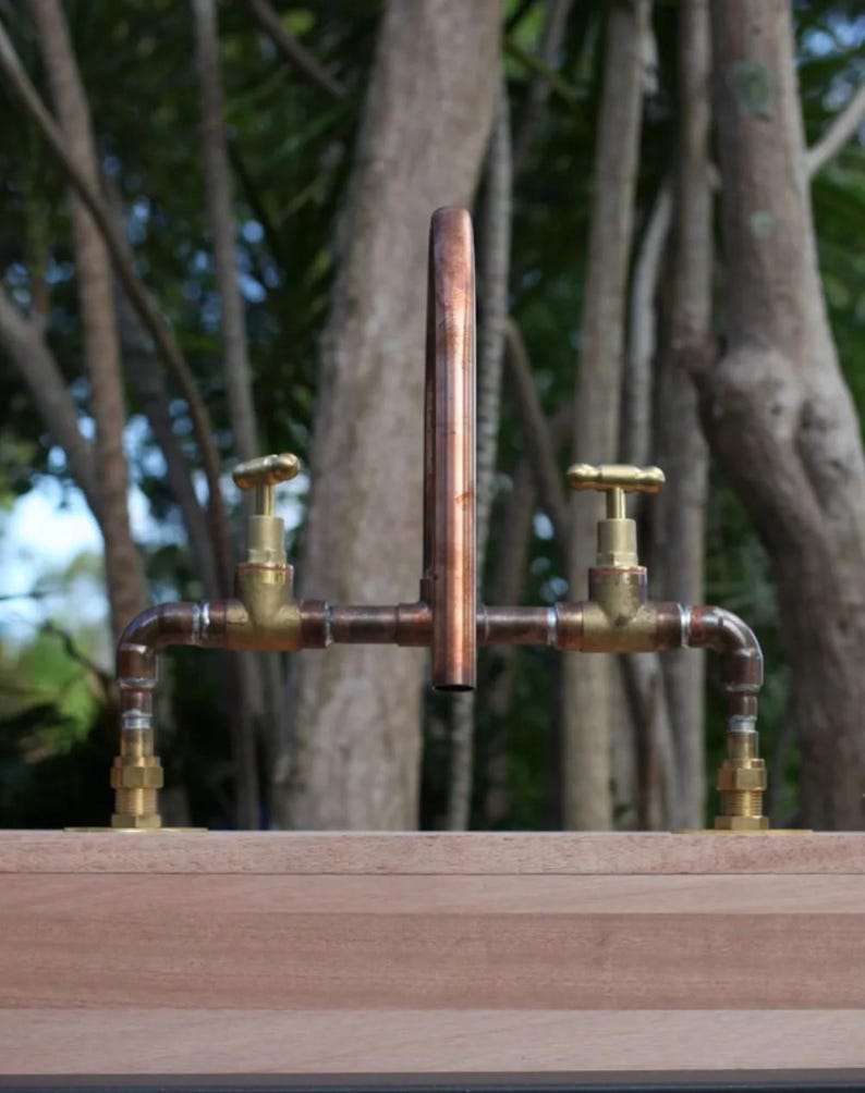 Artisanal copper faucet with dual hot & cold handles


