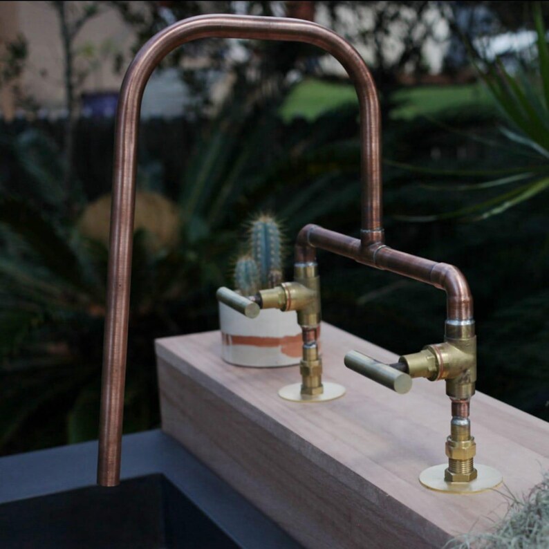 Artisanal handmade copper tap with brass valves for rustic sinks

