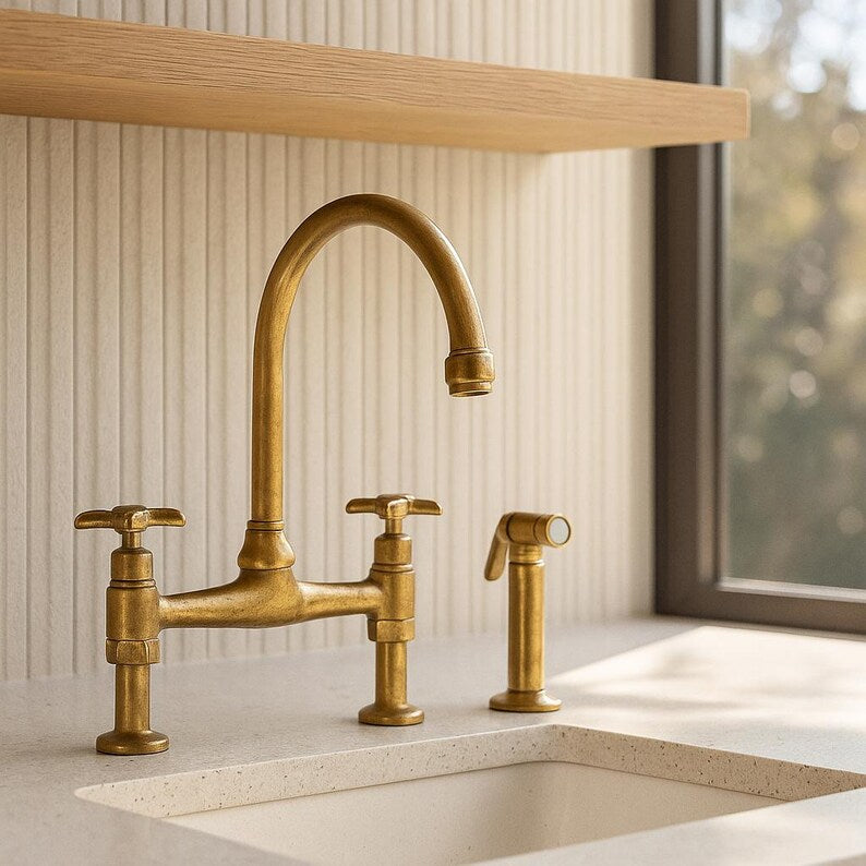 Brass bridge faucet with sprayer and cross handles

