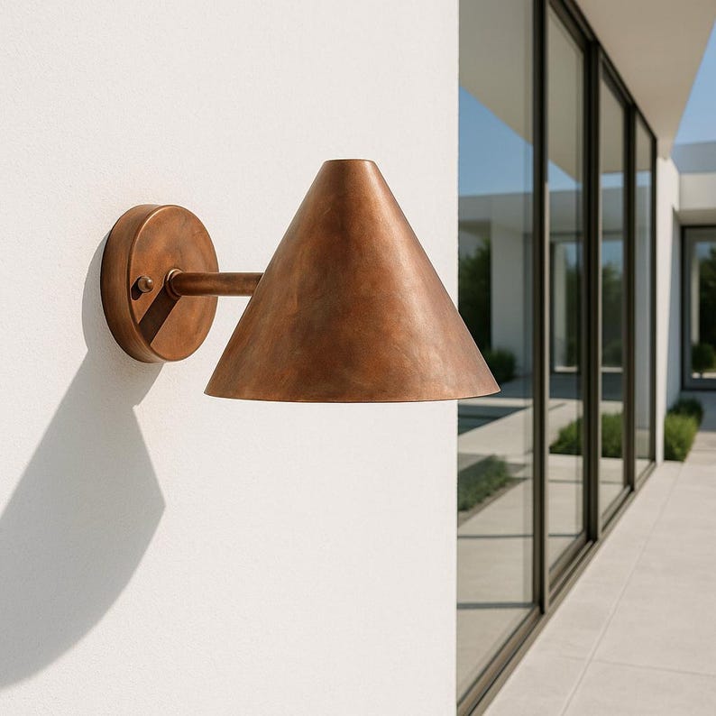 Brushed copper wall sconce – handcrafted cone light for modern interiors and patios

