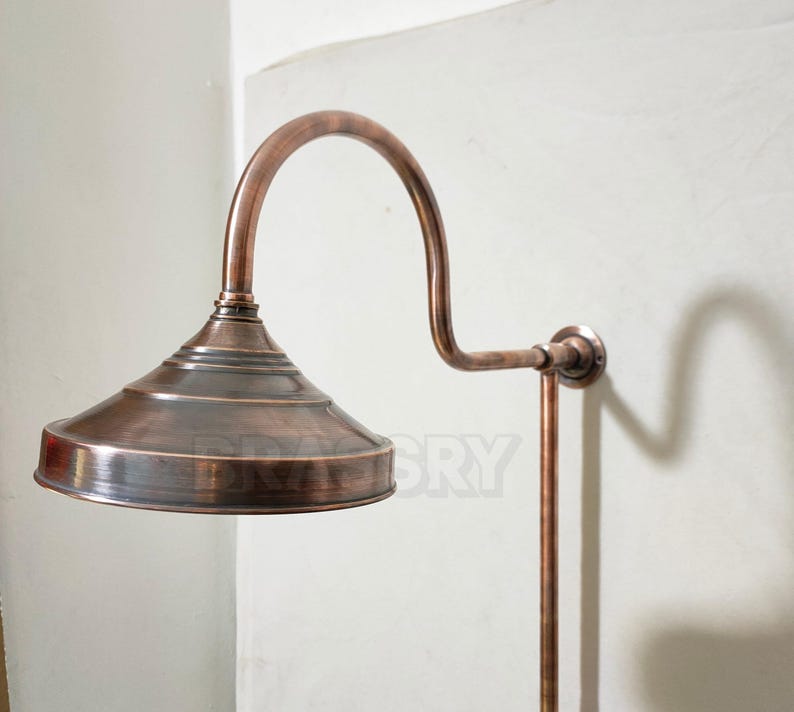 Close-up of antique copper shower head with water jets

