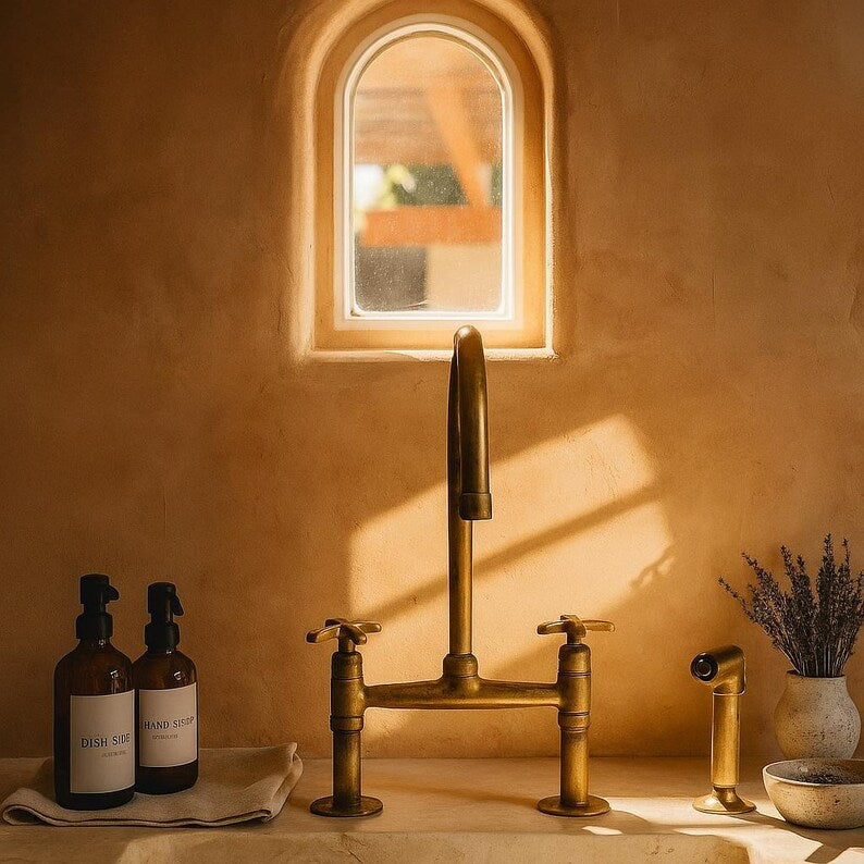 Farmhouse brass kitchen mixer in unlacquered finish

