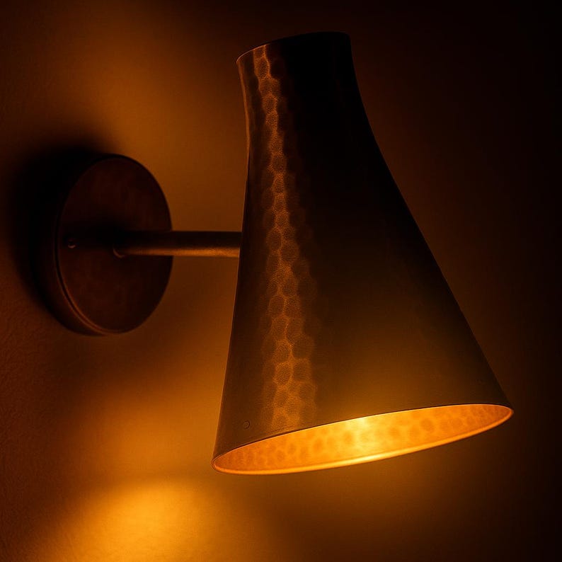 Hammered brass wall sconce with conical design – mid-century modern light fixture

