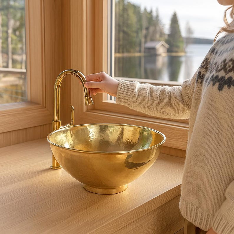 Hand-hammered brass sink with modern polished gold look