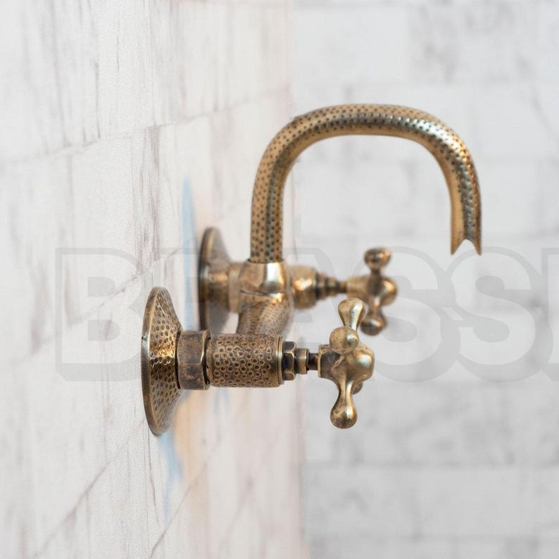 Hand-hammered brass wall mount bathroom faucet with oil-rubbed finish and vintage cross handles

