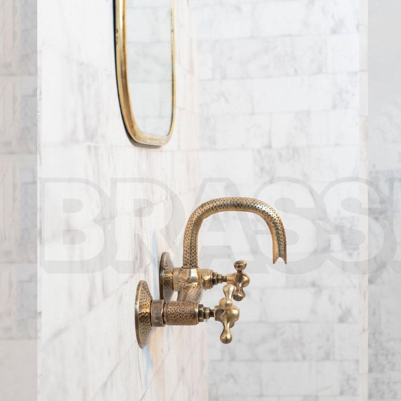 Hand-hammered brass wall mount bathroom faucet with oil-rubbed finish and vintage cross handles


