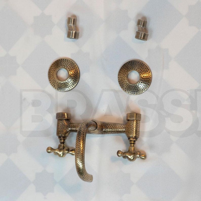 Hand-hammered brass wall mount bathroom faucet with oil-rubbed finish and vintage cross handles

