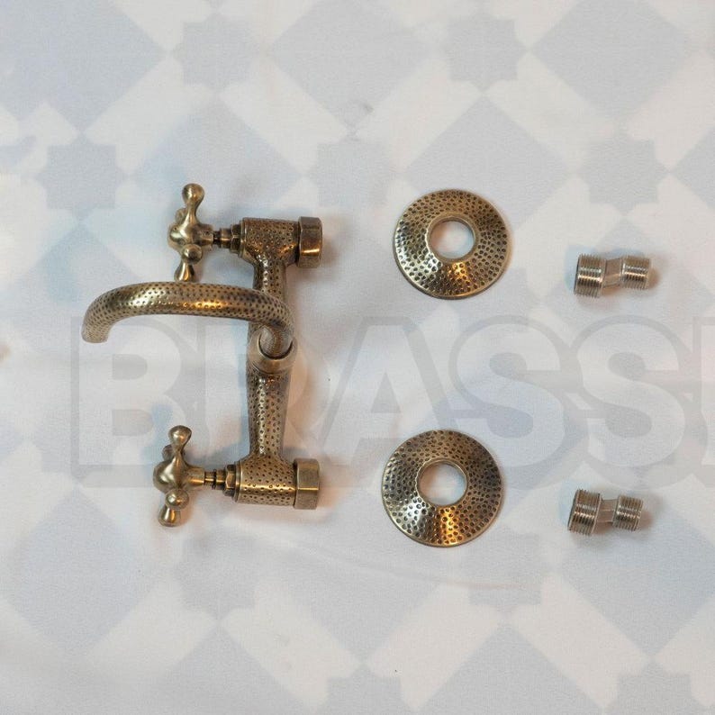 Hand-hammered brass wall mount bathroom faucet with oil-rubbed finish and vintage cross handles

