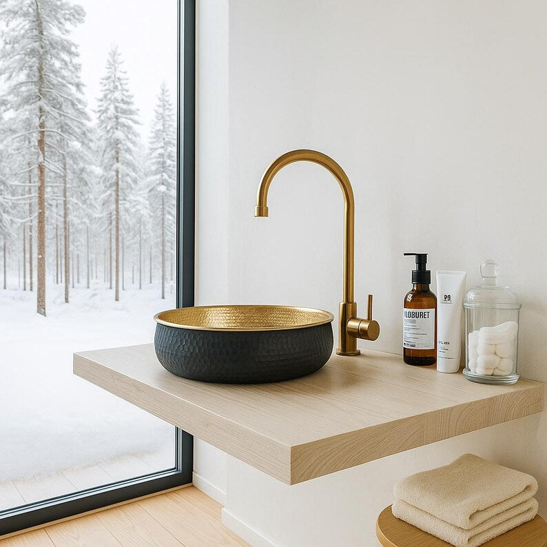 Hand-hammered round brass vessel sink with polished gold interior
