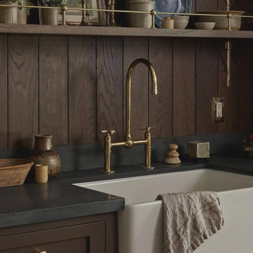Handmade Moroccan wall-mount faucet in solid unlacquered brass with gooseneck spout and cross handles

