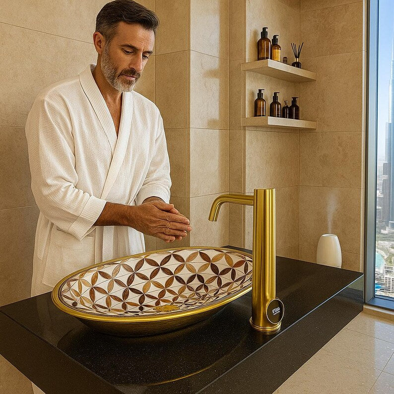 Handmade brass oval bathroom sink with flower inlay in bone and wood on white base

