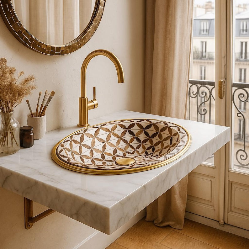 Handmade brass oval bathroom sink with flower inlay in bone and wood on white base

