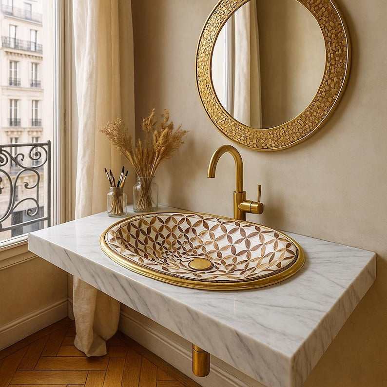Handmade brass oval bathroom sink with flower inlay in bone and wood on white base

