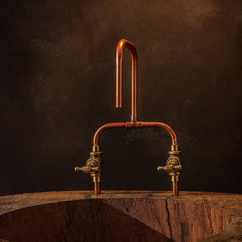 Handmade copper and brass faucet with U-shaped spout

