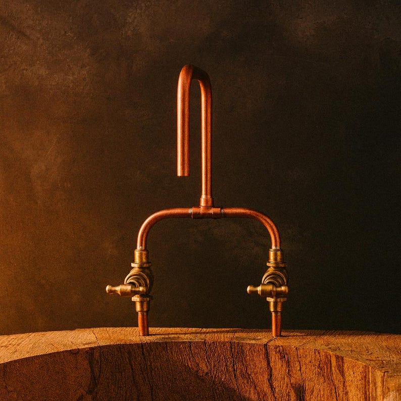 Handmade copper and brass faucet with U-shaped spout

