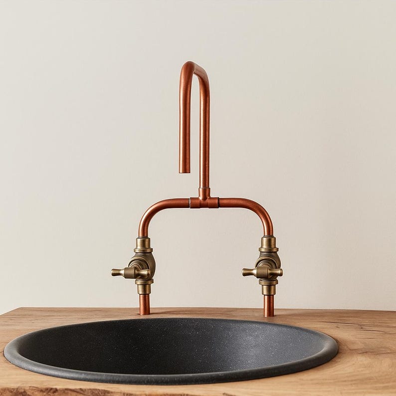 Handmade copper and brass faucet with U-shaped spout

