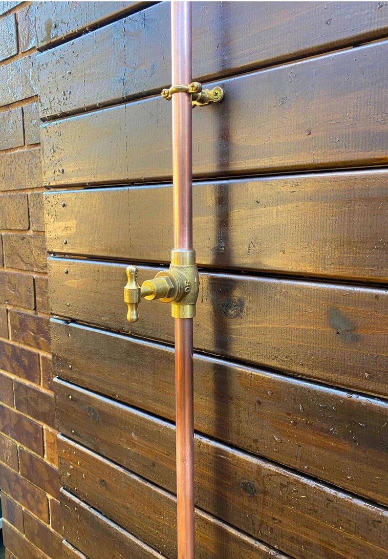 Handmade copper poolside shower with wide brass rose head

