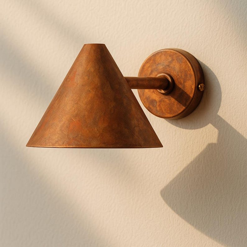 Handmade copper wall light with funnel design – artisan lighting for architectural homes

