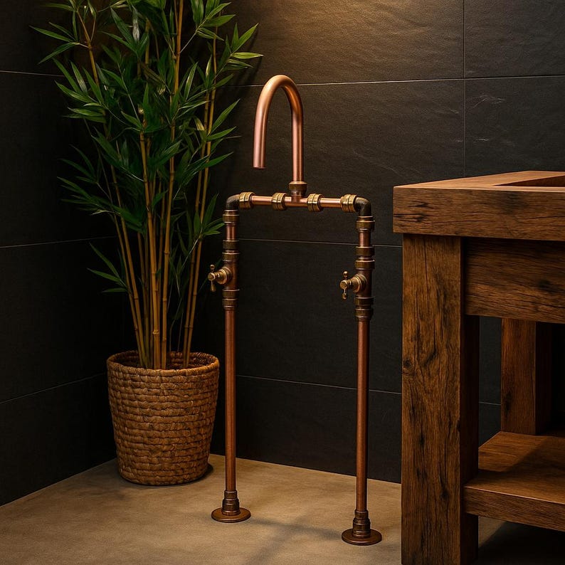 Handmade freestanding copper bath filler with brass taps

