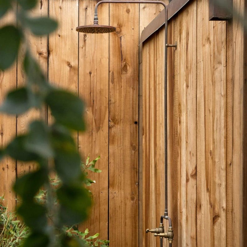 Rustic garden copper shower with dual hot and cold brass valves

