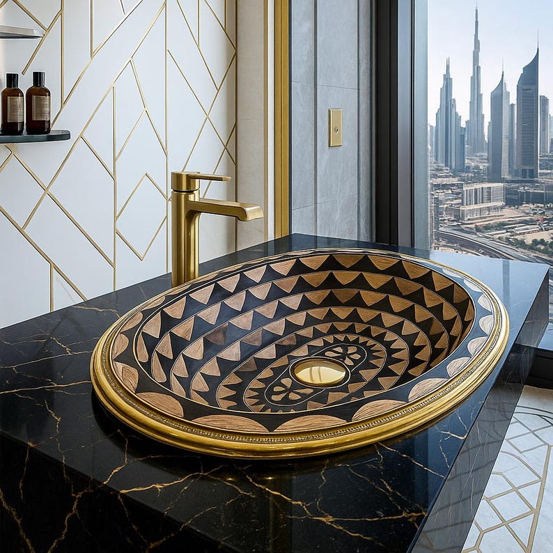 Handmade oval brass bathroom sink with black resin and bone inlay

