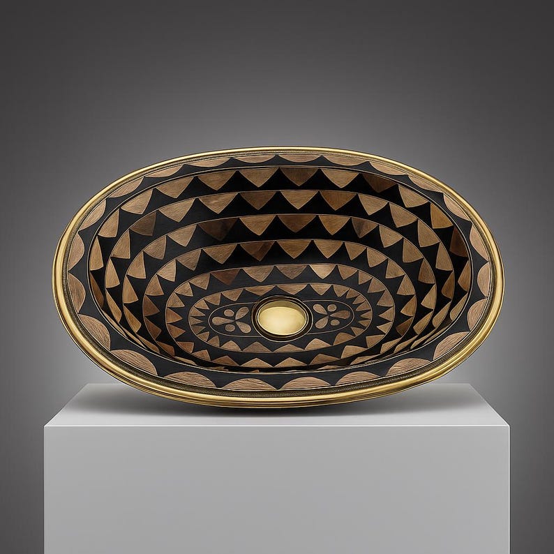 Handmade oval brass bathroom sink with black resin and bone inlay

