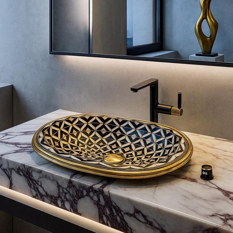 Handmade oval brass bathroom sink with bone and resin flower pattern inlay on black base

