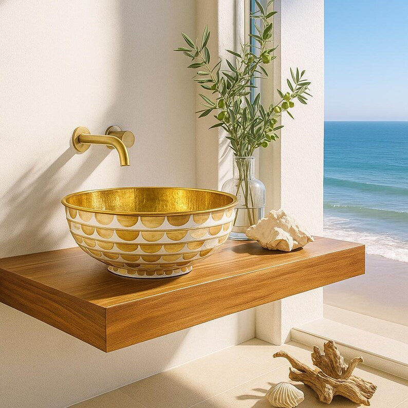 Handmade round brass vessel sink with hammered gold interior and ivory-toned wood inlays – countertop bathroom basin

