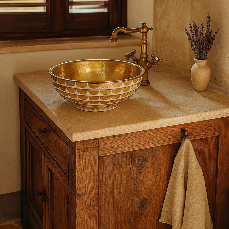 Handmade round brass vessel sink with hammered gold interior and ivory-toned wood inlays – countertop bathroom basin

